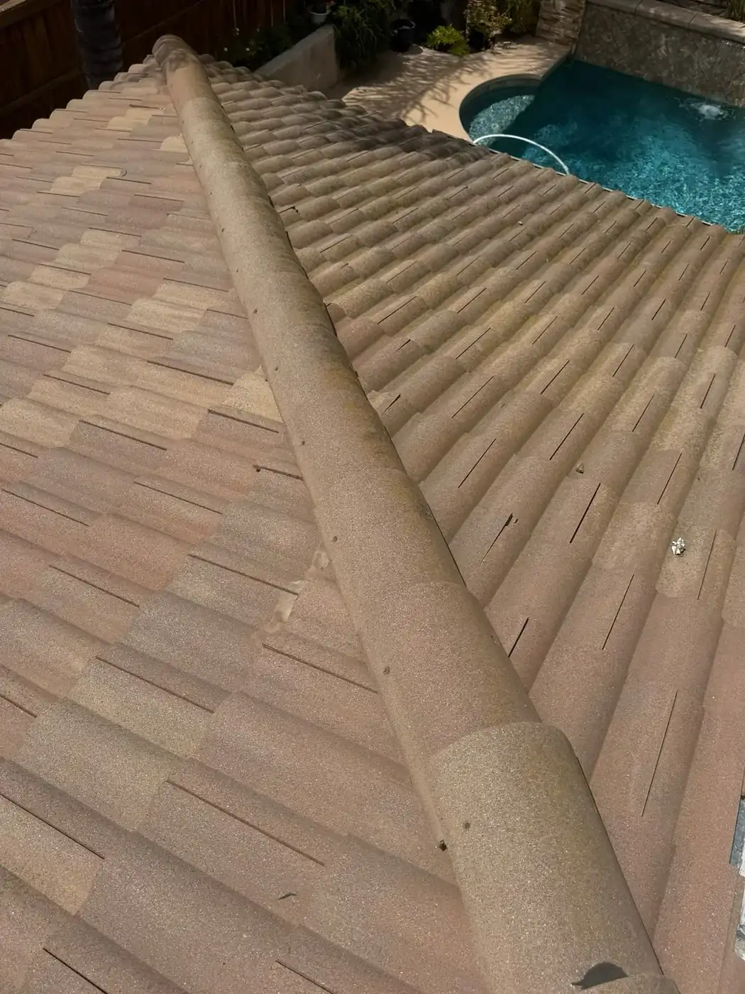 Roof repair technician replacing broken roof tiles in Wildomar, CA