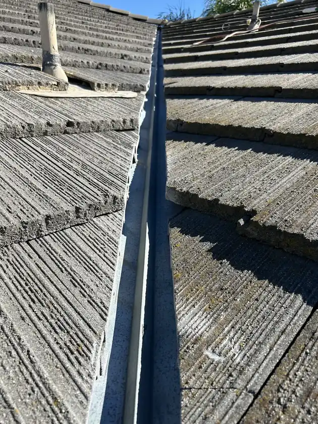 Roofer performing preventative roof maintenance in Temecula, CA