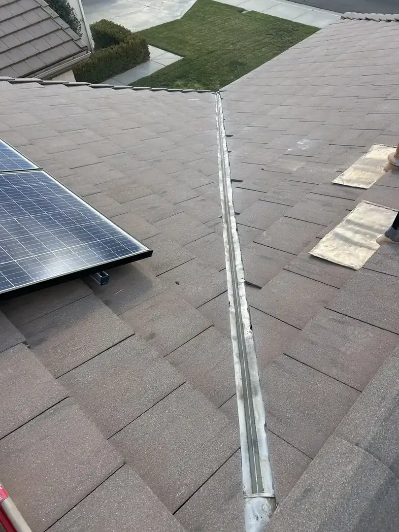 Roofer tracing a roof leak source in Temecula, CA