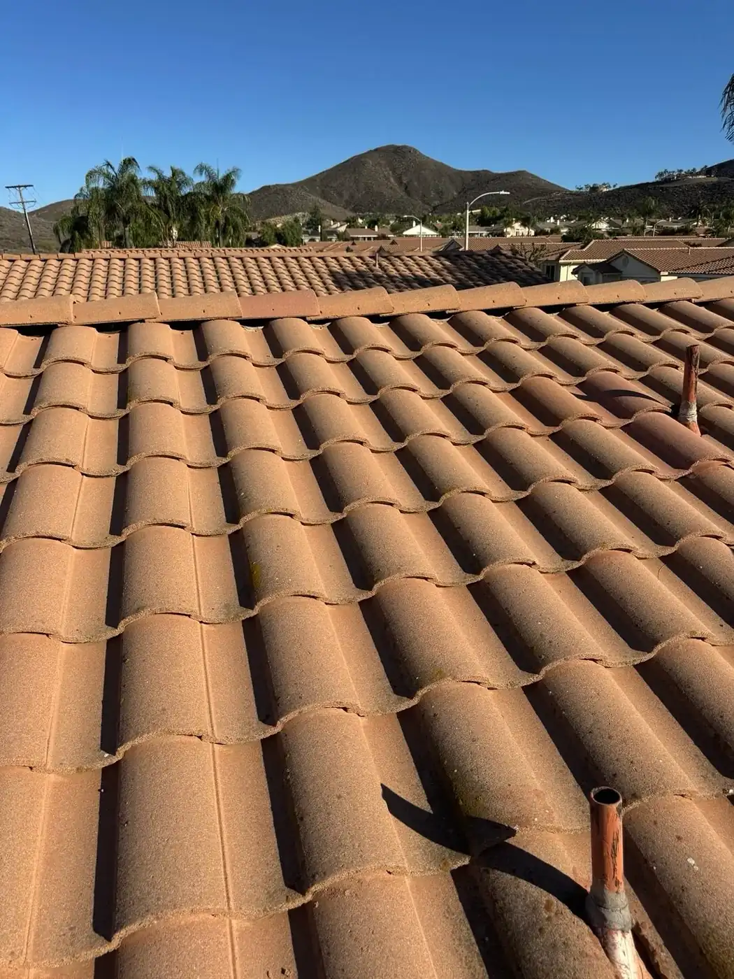 Tile roof repair in progress on a Temecula, CA home