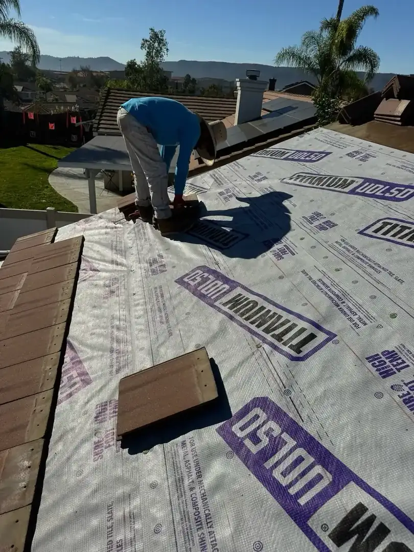 Roof valley cleaning during a roof tune-up in Temecula, CA