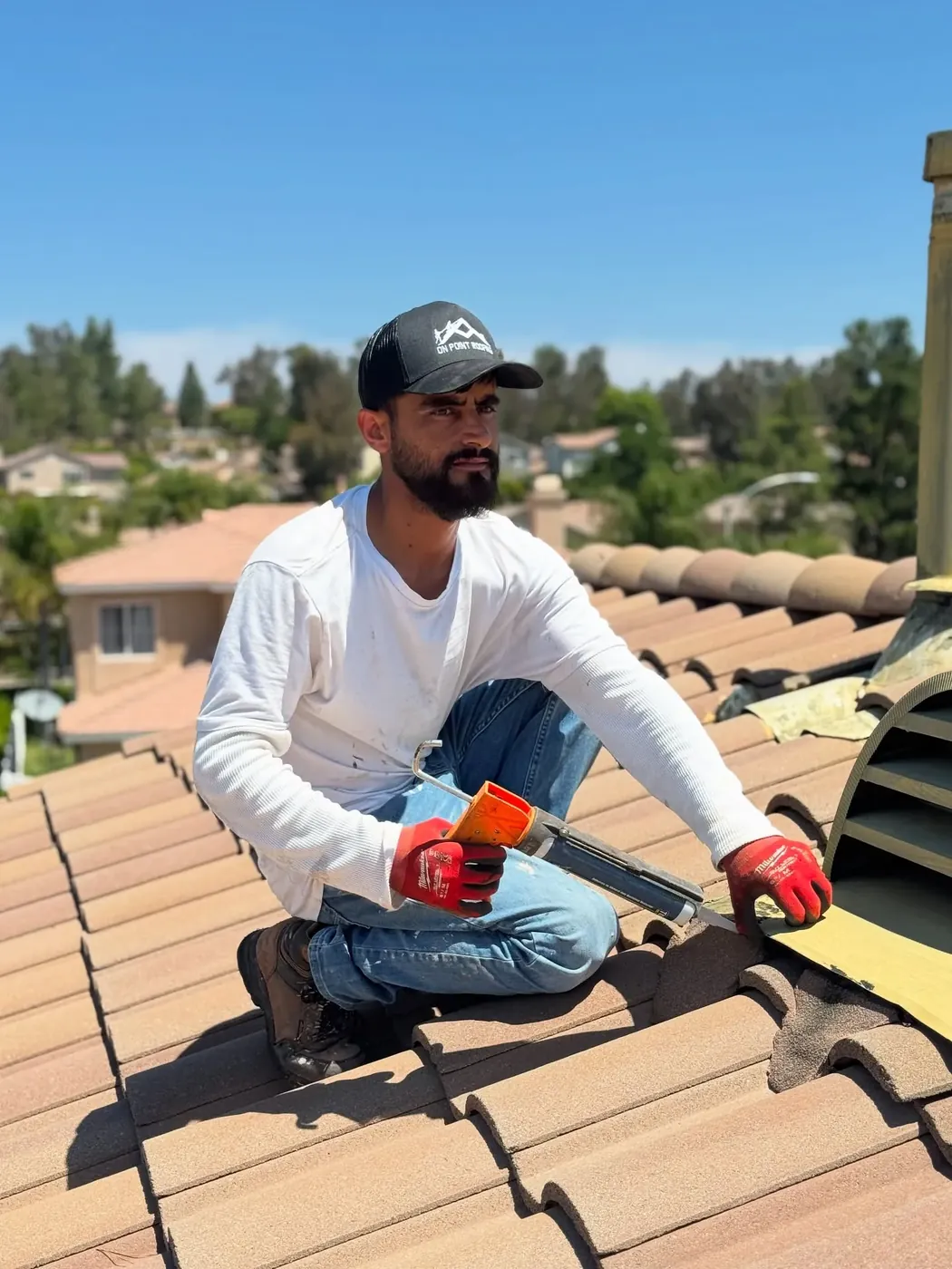 Tile roof repair specialist replacing tiles on a home in Wildomar, CA
