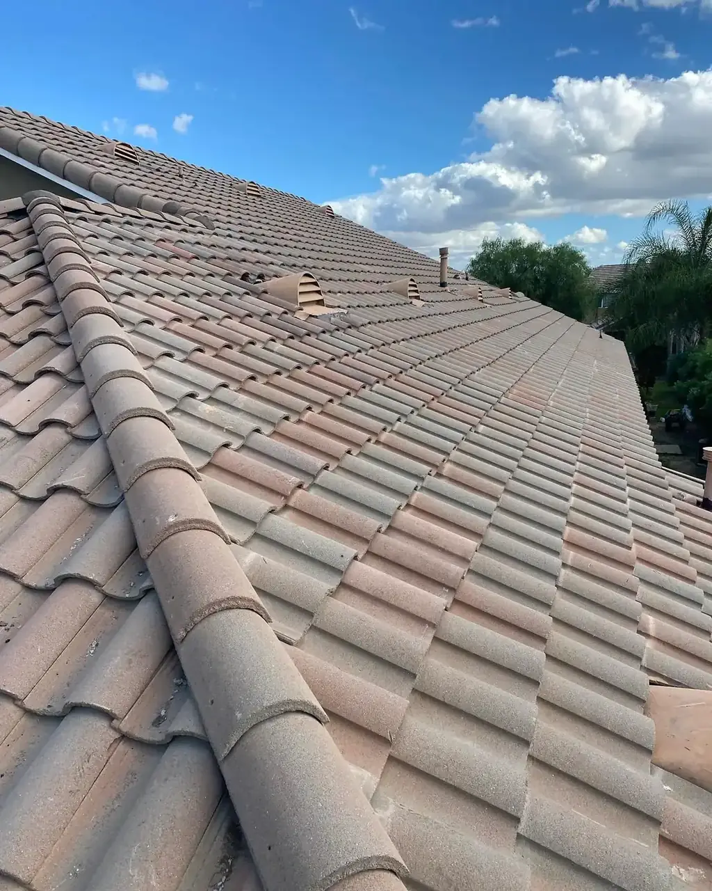 On Point Roofing Repair crew member repairing a tile roof in Riverside County, CA